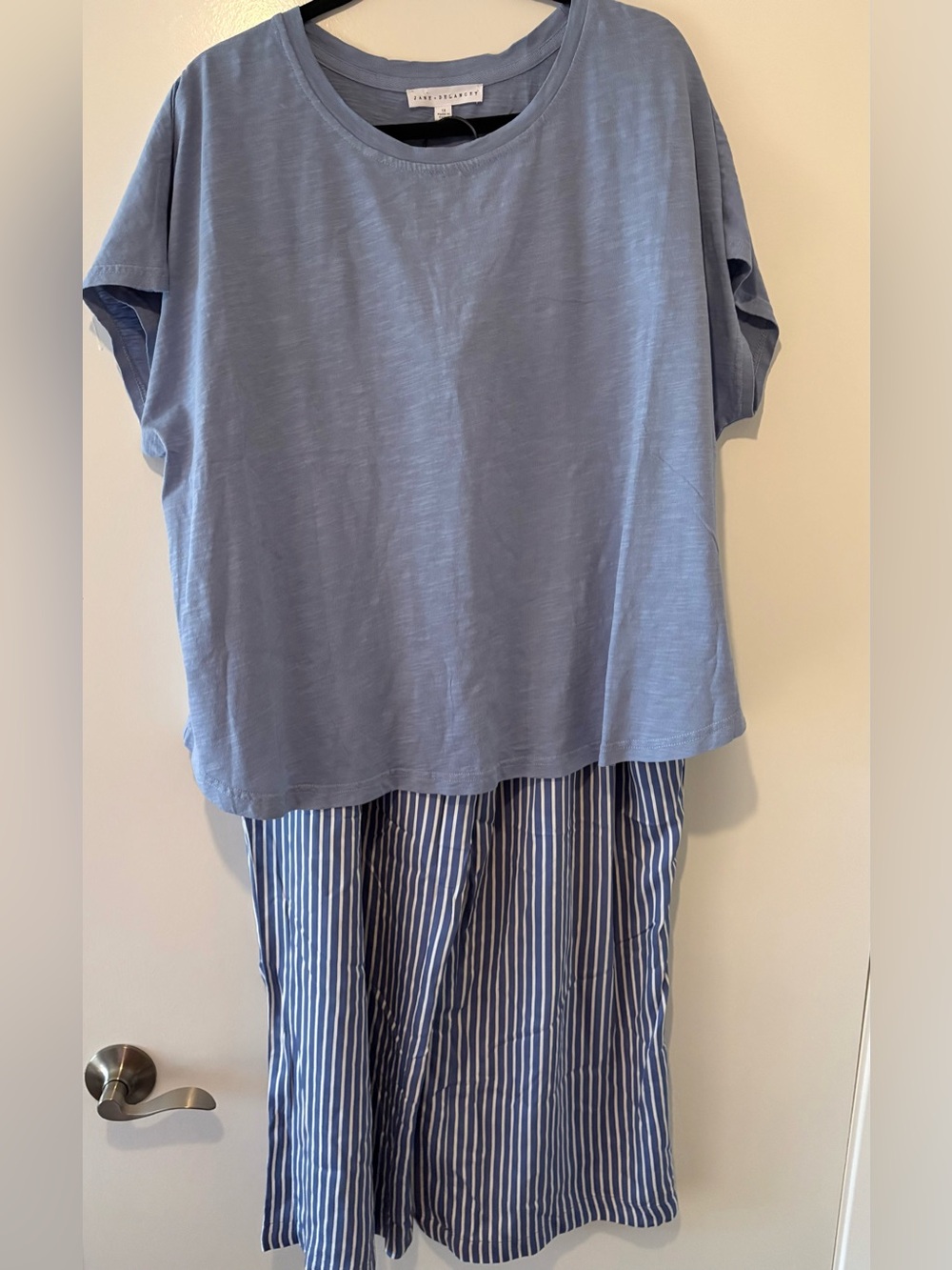Woman’s Outfit with blue striped cloth pants and matching blue shirt